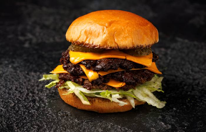 smash-burger-with-lettuce-cheddar-cheese-and-sauce-gm2161001744-581481886_searchscope=imagefilm (1)
